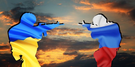Silhouettes of soldiers in colors of Ukrainian and Russian flags against cloudy sky