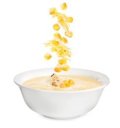 Image of Collage with ingredients falling into bowl of corn soup on white background 