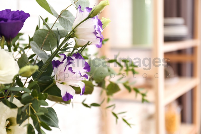 Photo of Bouquet of beautiful flowers in room, closeup view
