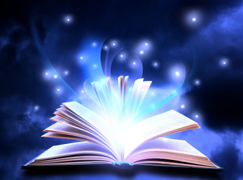 Open book with fairytales and magic lights on blue background. Creative design