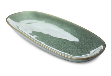 Photo of New green ceramic dish on white background