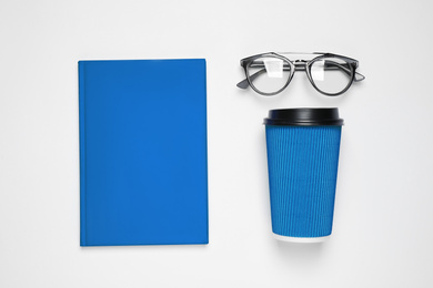 Flat lay composition inspired by color of the year 2020  (Classic blue) on white background