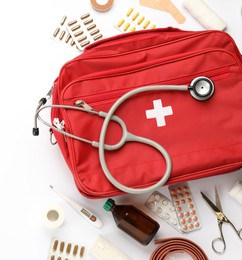 Flat lay composition with first aid kit on white background