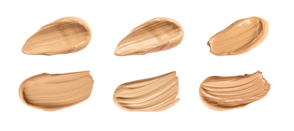Set with different shades of liquid skin foundation on white background, top view. Banner design