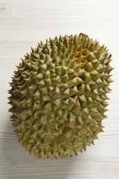 Ripe durian on white wooden table, top view