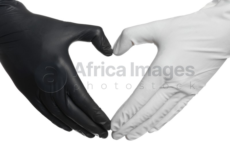 Doctor making heart shape with hands in different medical gloves on white background