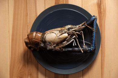 Photo of Fresh malaysian freshwater prawn on wooden table, top view