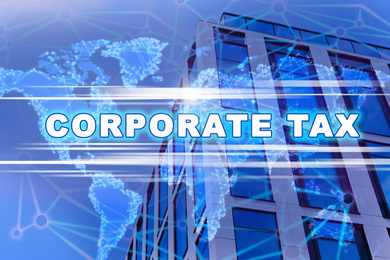 Image of Corporate tax concept. Double exposure of digital world map and modern office building outdoors 