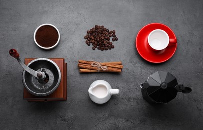 Photo of Flat lay composition with vintage manual grinder and geyser coffee maker on black table