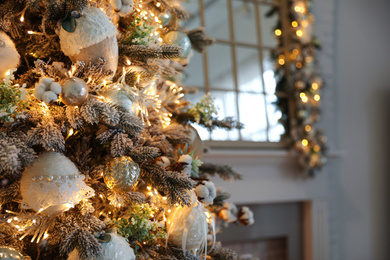 Closeup view of beautiful decorated Christmas tree indoors