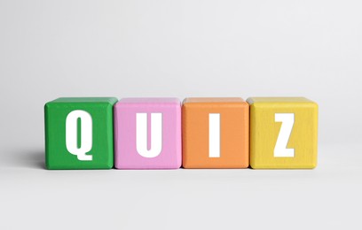 Colorful cubes with word Quiz on white background