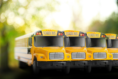 Image of Yellow school buses outdoors. Transport for students
