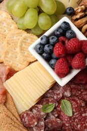 Photo of Snack set with delicious Parmesan cheese, top view