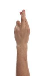 Man with crossed fingers against white background, closeup of hand