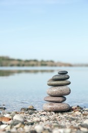 Stack of stones on beach, space for text. Harmony and balance concept