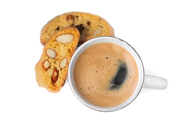 Photo of Tasty cantucci and cup of aromatic coffee on white background, top view. Traditional Italian almond biscuits