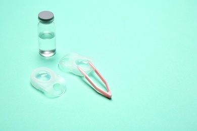 Contact lenses and accessories on color background