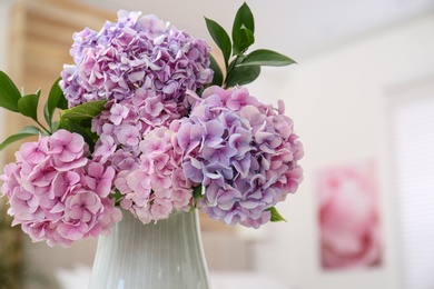 Photo of Bouquet of beautiful hydrangea flowers indoors, closeup