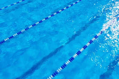 Swimming pool with racing lane dividers, closeup view
