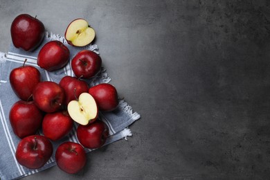 Photo of Fresh ripe red apples on grey table, flat lay. Space for text