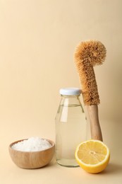 Eco friendly cleaning supplies for washing dishes on beige background. Conscious consumption