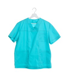 Photo of One turquoise medical uniform isolated on white
