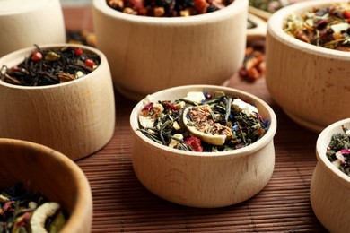 Many different herbal teas on bamboo mat