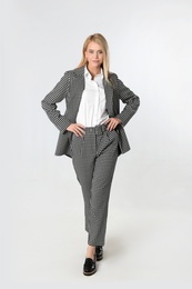 Full length portrait of young businesswoman on white background