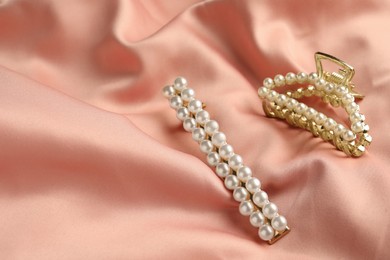 Elegant hair clips with pearls on pink silk