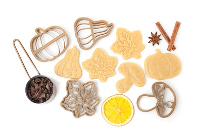 Photo of Flat lay composition with cookie cutters and unbaked biscuits on white background