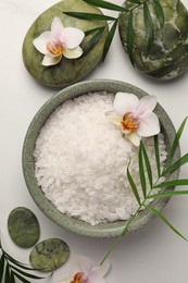 Photo of Flat lay composition with spa products and flowers on white marble table