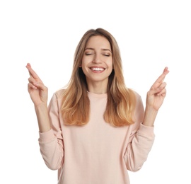 Woman with crossed fingers on white background. Superstition concept