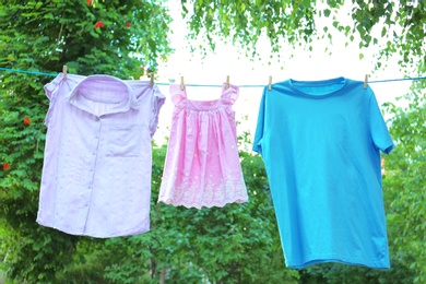 Clothes on laundry line outdoors on sunny day