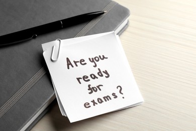 Note with question Are You Ready For Exams? on white wooden table