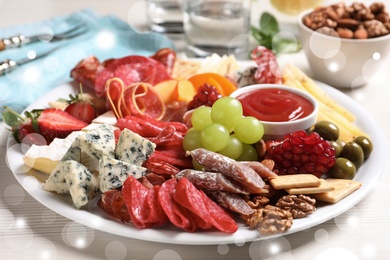 Photo of Plate of different appetizers with dip sauce on white table, closeup. Bokeh effect