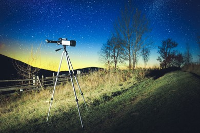 Photo of Modern telescope and beautiful sky in evening outdoors. Learning astronomy