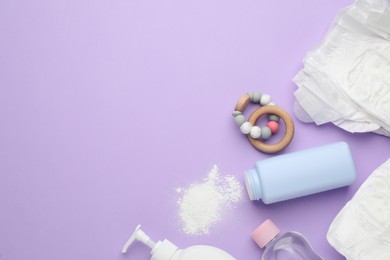 Photo of Flat lay composition with dusting powder and other baby care products on violet background, space for text