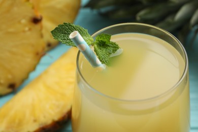 Photo of Delicious fresh pineapple juice with mint, closeup