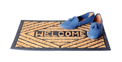 Blue female shoes on brown welcome doormat against white background