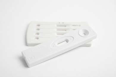 Two disposable express tests for hepatitis on white background