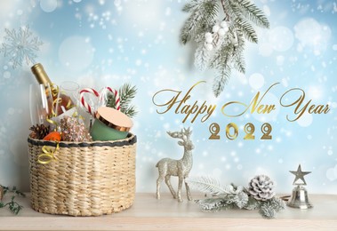 Happy New 2022 Year! Wicker basket with gift set and decor on wooden table