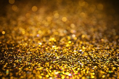 Shiny golden glitter as background. Bokeh effect