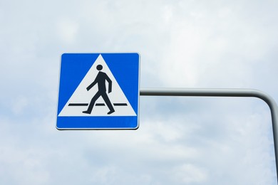 Traffic sign Pedestrian Crossing against blue sky