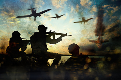 Silhouettes of soldiers and planes in combat zone. Military service