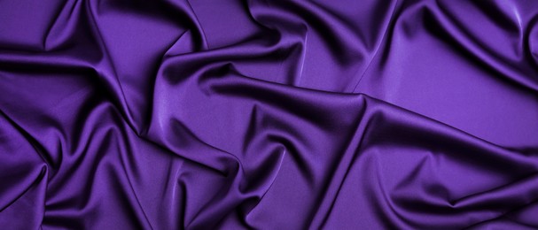 Dark purple silk fabric as background, top view. Banner design