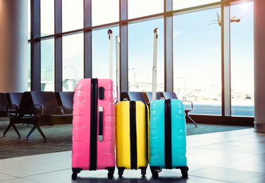 Travel suitcases in airport terminal. Summer vacation