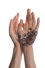 Woman with henna tattoo on palm against white background, closeup. Traditional mehndi ornament