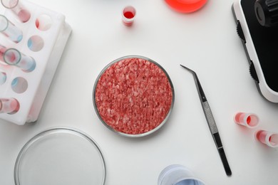 Photo of Sample of minced cultured meat on white lab table, flat lay