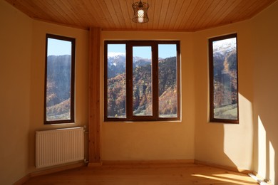 Photo of Empty room with clean windows and beige wall indoors