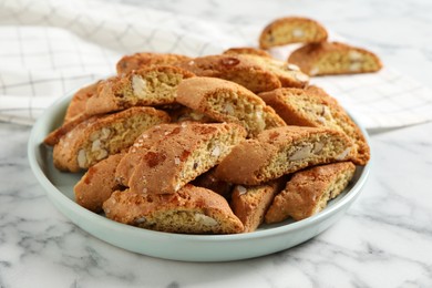 Photo of Traditional Italian almond biscuits (Cantucci) on white marble table